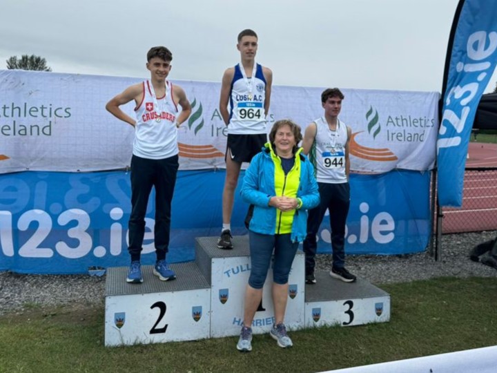 Cai Lewis (left) receiving his silver medal from grandmother Mary Purcell