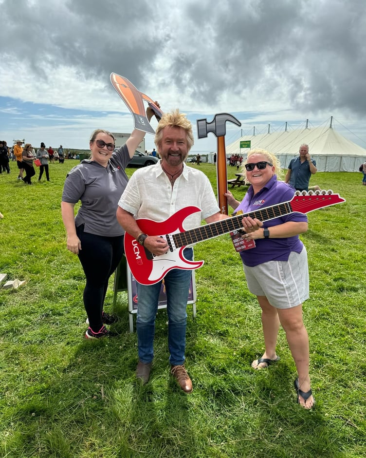 Noel Edmunds with University College Isle of Man staff at the Southern Agricultural Show