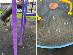 Smiley face and love heart graffiti daubed on playpark equipment