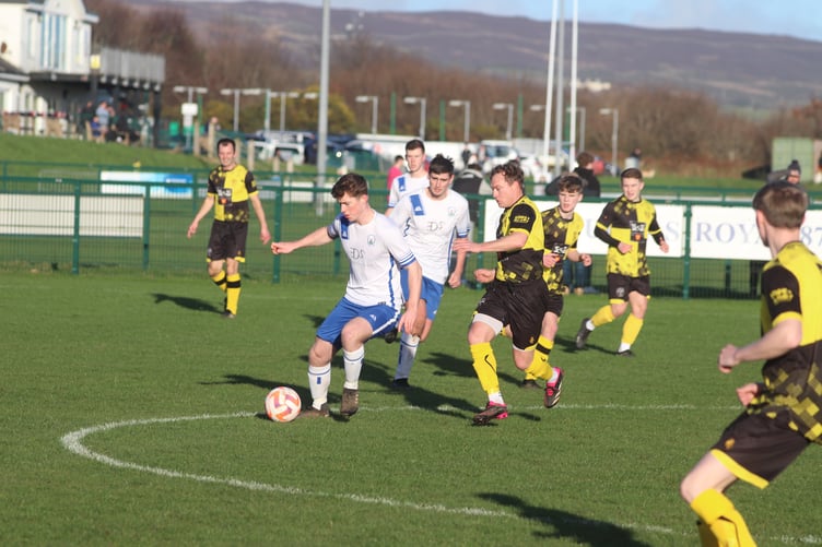 Douglas Royal's Sam Baines and St George's Chriss Bass Jr (Photo: Paul Hatton)
