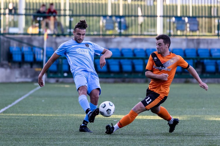 Rushen United's Joe Reid (left) and Ayre United's Harry Best went toe-to-toe in the Charity Shield two years ago. The two sides lock horns again in the same match next Friday at the Bowl (Photo: Gary Weightman)