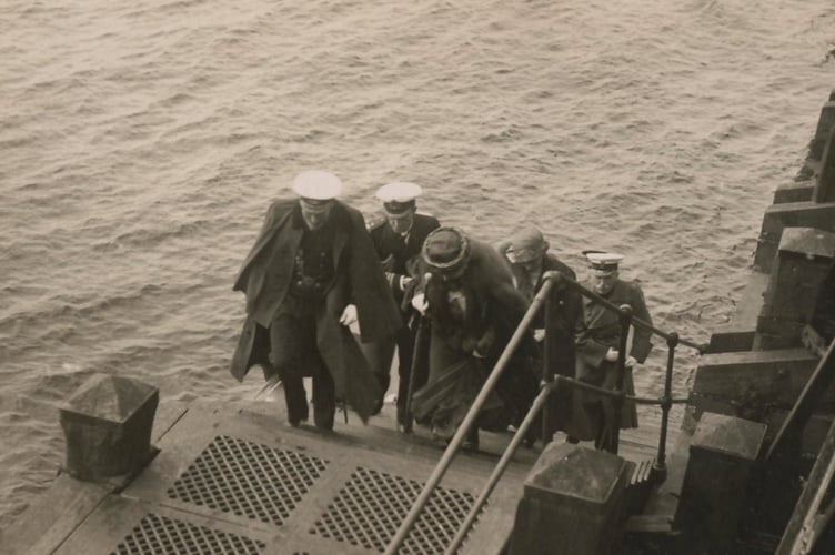 Queen Mary helped up the steps at Ramsey's Queen's Pier in 1920