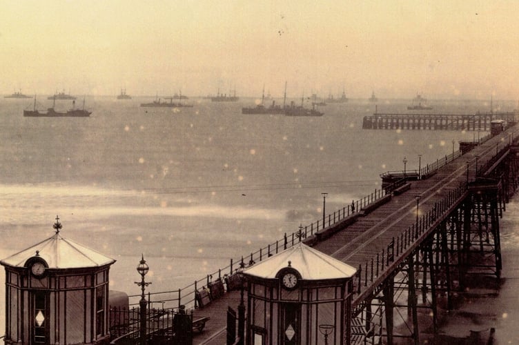 Ramsey's Queen's Pier back in 1900 with a fleet of military ships