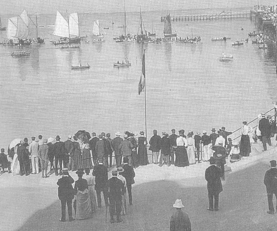 Crowds watching a regatta by Ramsey's Queen's Pier