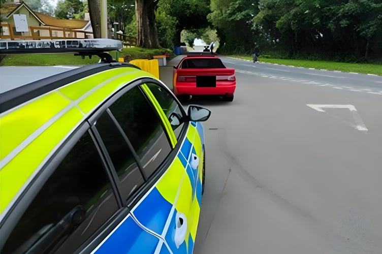 Police stop a car on the Mountain Road