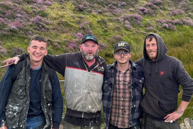From left to right: Jacob Kelly, Paddy O’Neil, Jake Mayers and Nic Tinnion who repainted the giant three Legs of Man landmark at North Barrule