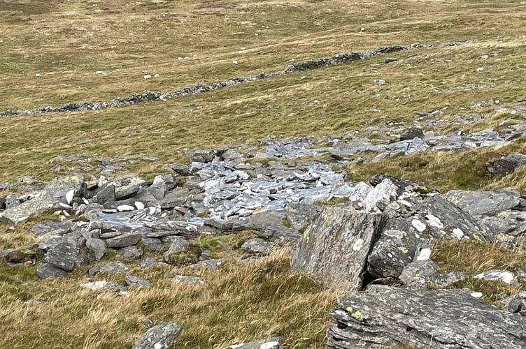 The stones of the North Barrule three legs when they were painted grey