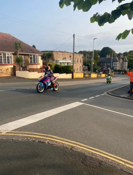 Riders return to the Grandstand wrong way up Bray Hill on Sunday evening
