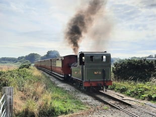 Drama as steam train collides with a car at railway crossing