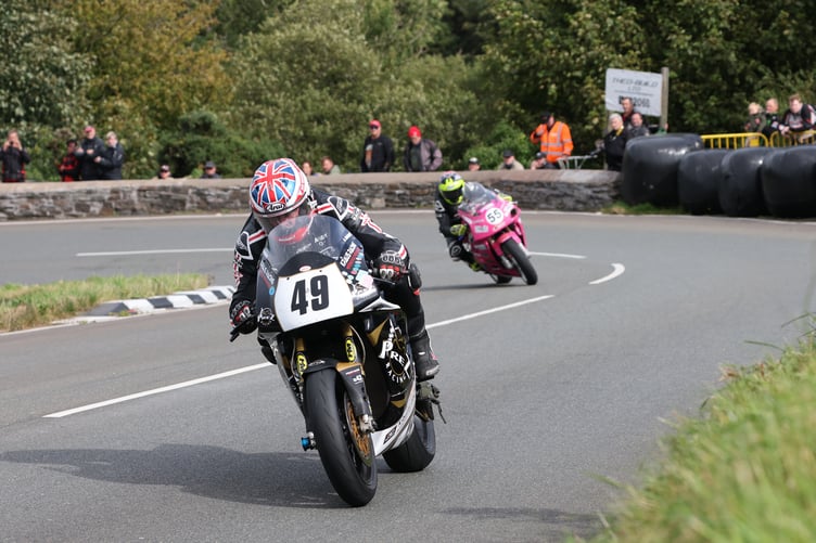 Exeter's Andy Hornby leads Wayne Bourgeais at the Gooseneck during Thursday afternoon's Manx Grand Prix qualifying session