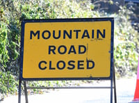 Mountain Road closed due to broken down wagon in foggy conditions 