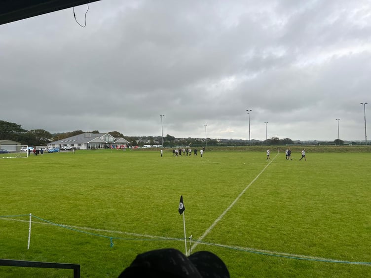 Castletown players walk into the changing rooms at Station Fields