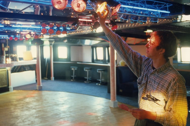 The SS Manxman became a nightspot with discos, restaurants and bars in Hull. Pictured is electrician Tim Houtlon makes adjustments to one of the disco lights on the dancefloor in 1994.