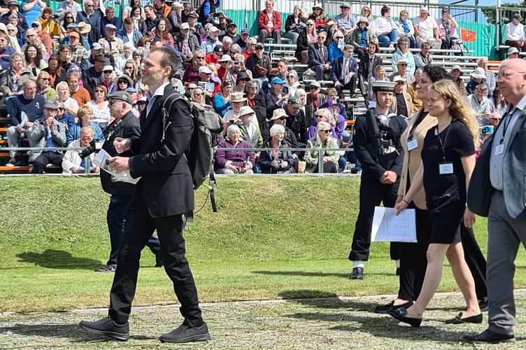 Left to right: Francesca Marzocca, Julia Bell and Peter Washington presenting the petition on Tynwald Day