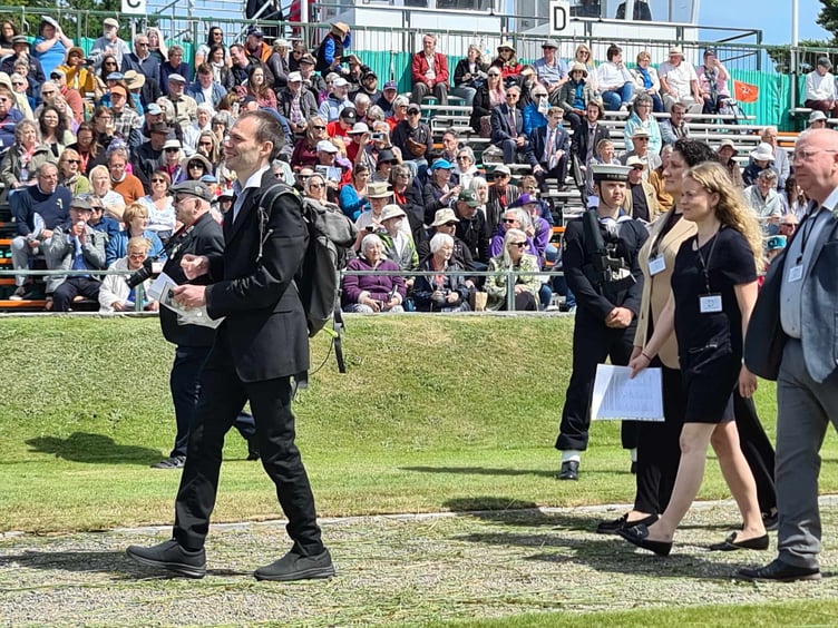 Left to right: Francesca Marzocca, Julia Bell and Peter Washington presenting the petition on Tynwald Day