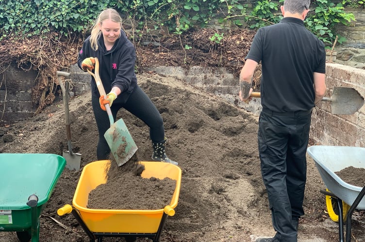 PlayItForward scheme and Manx Wildlife Trust volunteers working at the site of the new community garden at Government House