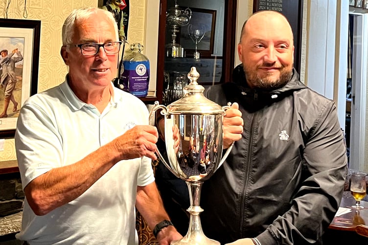 Vice-captain Geoff Corke (left) presents 2024 Club Champion Mark Gelling with the trophy at Rowany