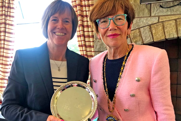 2024 Club Champion Chris Skelly (left) receives the silverware from Peel Town Commissioners chair Christine Moughtin