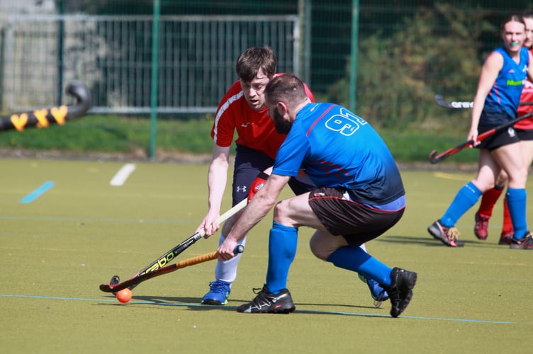 Valkyrs A's Sam Moffat (left) under pressure from Ali Fappiano of Valkyrs B during last Saturday's interclub derby at QEII High School (Photo: Dave Norton)