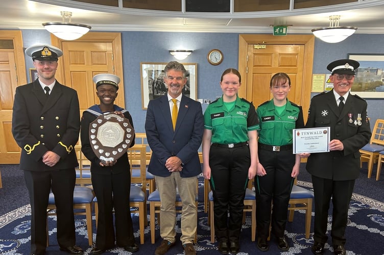 The President of Tynwald, Laurence Skelly, MLC, with, left to right, Isle of Man Sea Cadets sub-lieutenant Nathan Jones RNR and Best Turned Out Individual Jesse Ringrose-Smith and Rebecca and Shannon Kiely, representing St John Ambulance Isle of Man