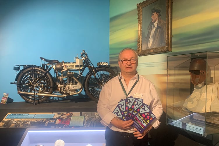 Manx National Heritage's Daniele Tortasso showcases the heritage open days brochures for 2024