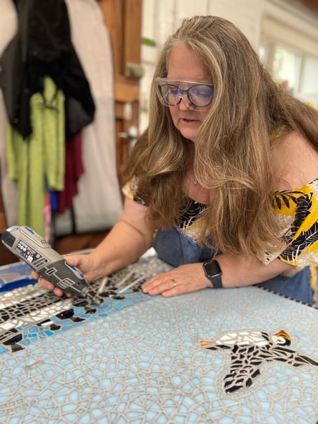 Debra Tracy works on the RNLI 200th anniversary mural
