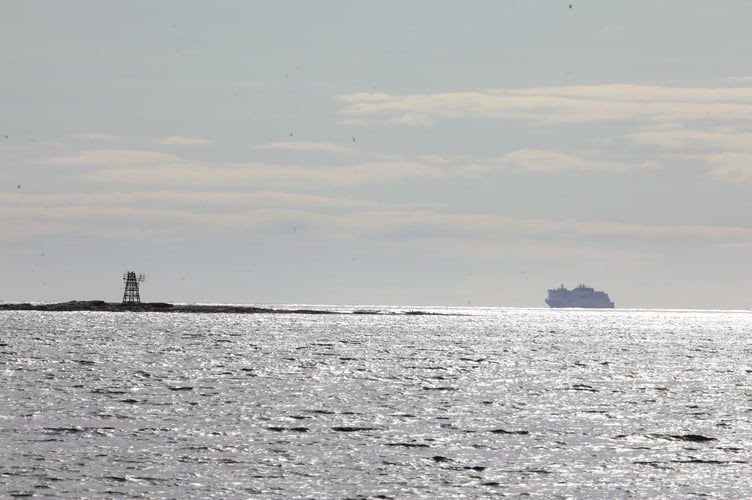 Manxman Celebration cruise in the distance, about to pass Gansey Beach. 