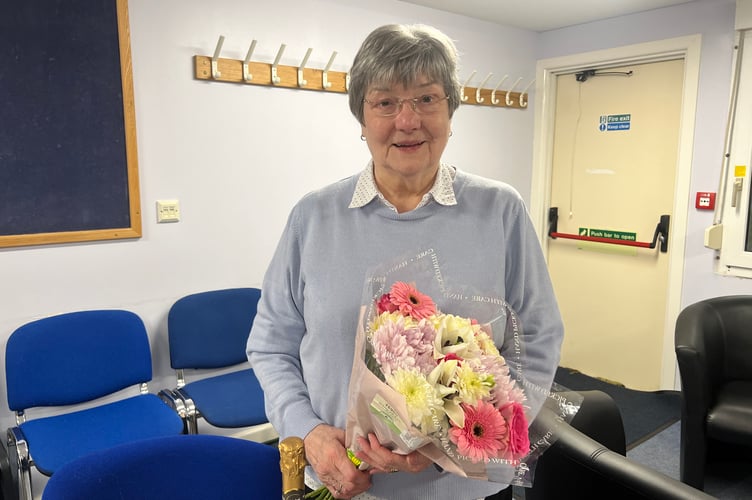 Rita Steele with her gifts after a 25-year career as an exam invigilator 