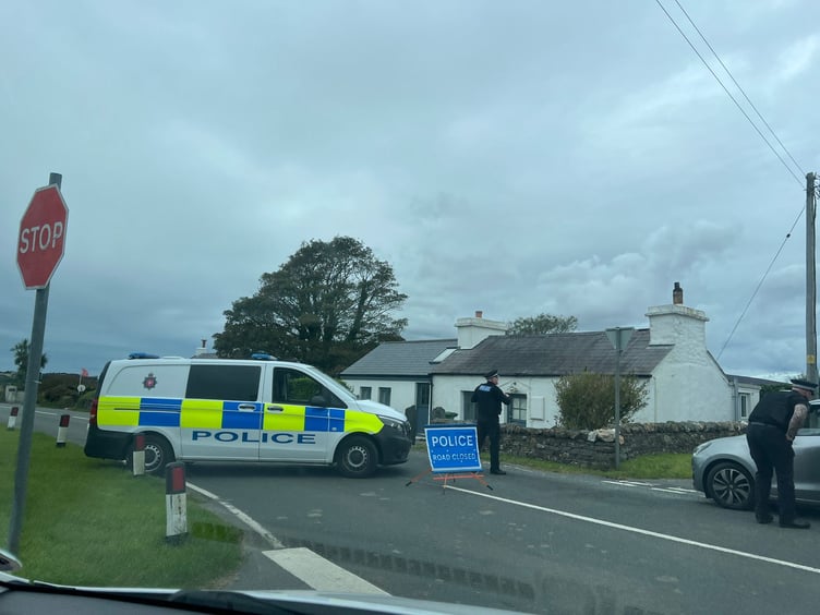 Police have closed the road at the Braaid