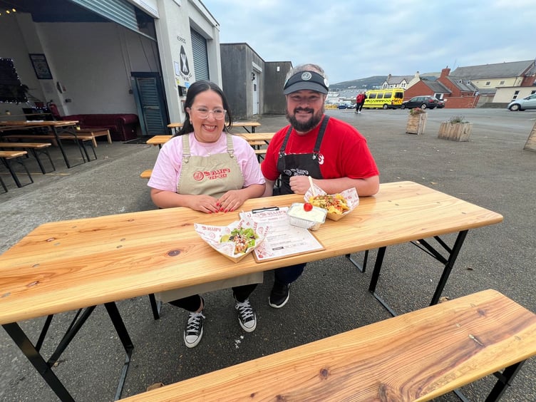Natalie and Michael alongside some of their popular dishes