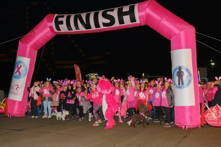 Participants line up before starting the moonlight walk on Douglas Promenade (Adele Priest Photography)