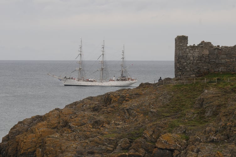 Three-master sailing ship Christian Radich behind Peel Castle