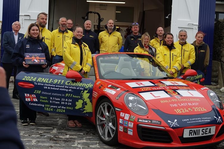 Members of the Port St Mary RNLI with the emblazoned Porsche 911