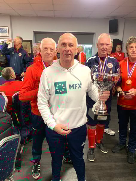 Isle of Man walking footballer Steve Falconer with the trophy after helping England win the recent International Invitational Tournament in Redditch