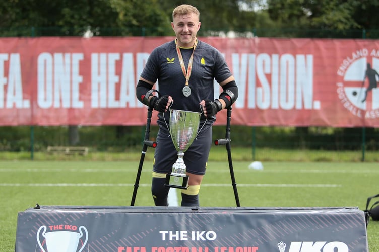 Isle of Man amputee footballer Sean Jackson celebrates with the IKO England Amputee Football League trophy (Photo: Three Lines Photography)
