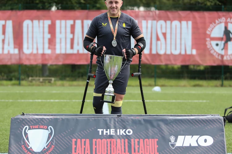 Isle of Man amputee footballer Sean Jackson celebrates with the IKO England Amputee Football League trophy (Photo: Three Lines Photography)