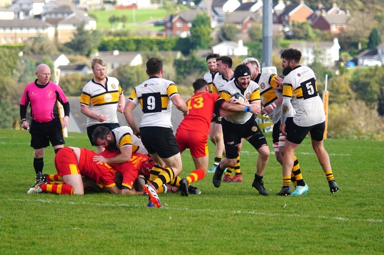 Vagabonds’ Tom Gascoyne trying to thread his way through a crowd of players during Saturday's clash with De La Salle at Ballafletcher (Photo: John Liver/Mumbles Pics)
