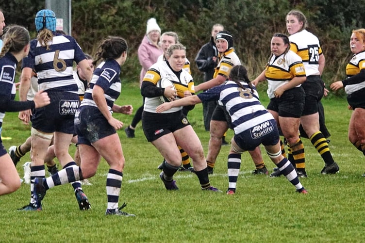 Vagabonds' Jules Harrison finds a gap in the Eccles defence during Saturday's Women’s NC Two North (South) clash at Ballafletcher. Harrison marked her return from maternity with two tries to help the Manx side win 22-7 (Photo: Mumbles Pics/John Liver)
