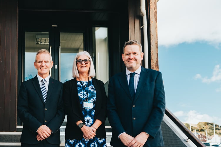 (Left to right) Seamus Byrne, Ethel Docherty and James Royston outside Steam Packet headquarters in Douglas