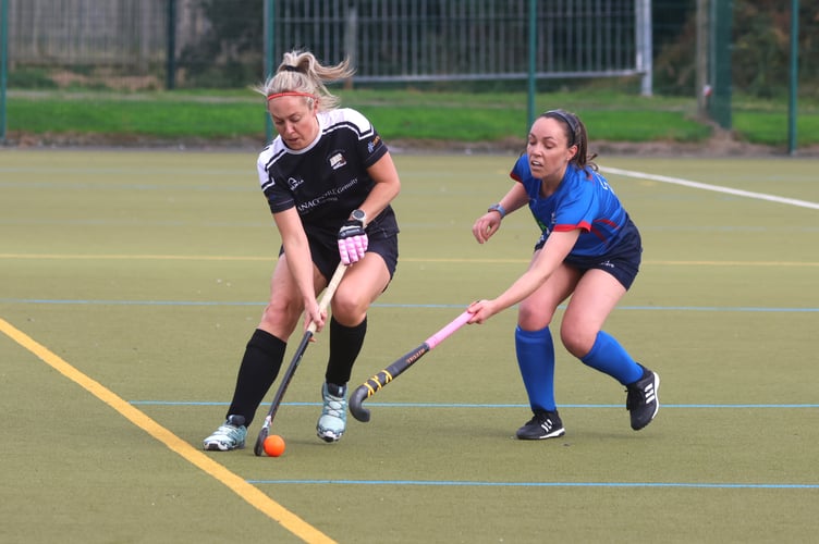 Vikings' Katie Errock (left) looks to escape the attentions of Valkyrs opponent Ellen Robinson during a recent mixed league match (Photo: Paul Hatton) 