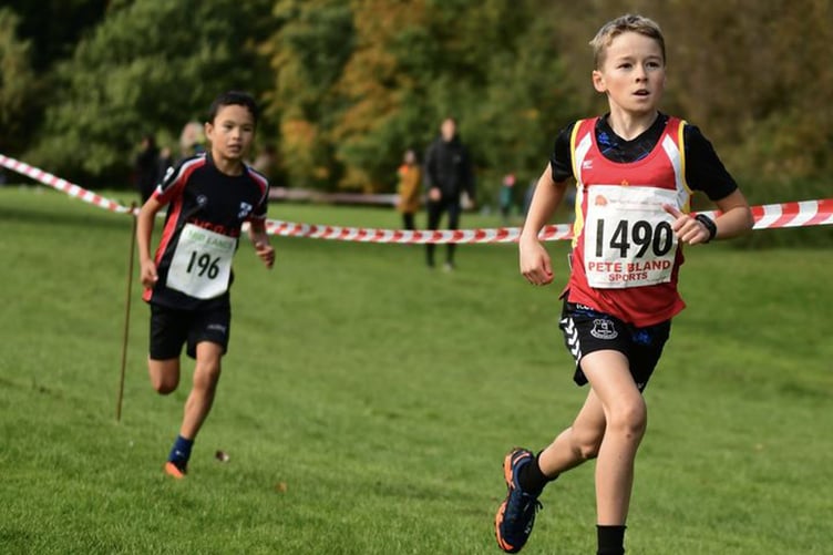 Leighton Curphey (right) on his way to victory in last Saturday’s Red Rose and Mid-Lancs Cross-Country League fixture, held at Witton Park in Blackburn (Photo: David’s Running Photos)