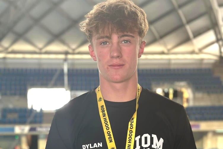Dylan Larrosa with his bronze medal he won in the 16 and over 100m breaststroke