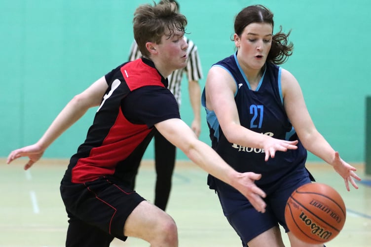 Mairi Harrison and Matthew Jones battle to reach the loose ball during the Hoops v Ravens match-up at the NSC (Photo: Oliver Hamilton)