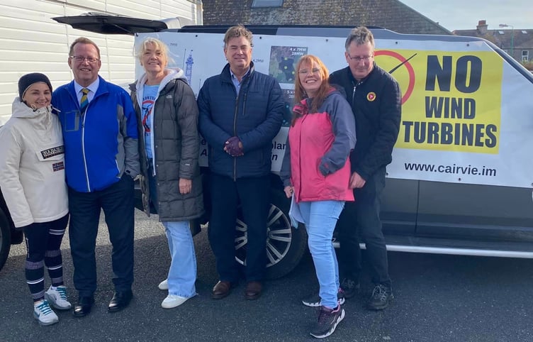 Protesters outside the Castletown Manx Utilities wind farm consultation event with Tim Glover MHK