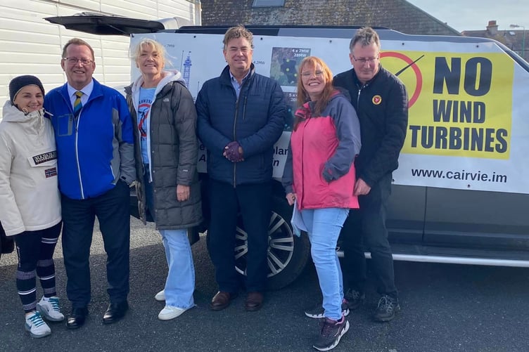 Protesters outside the Castletown Manx Utilities wind farm consultation event with Tim Glover MHK