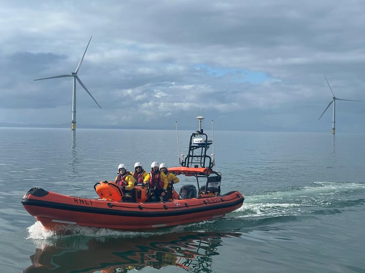 A UK RNLI crew take part in a casualty transfer exercise at Ørsted’s Burbo Bank Offshore Wind Farm in the Irish Sea