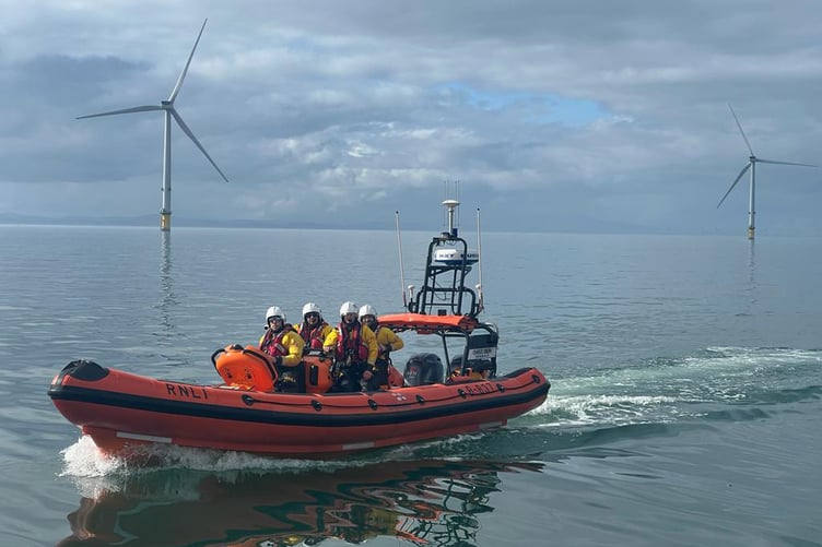 A UK RNLI crew take part in a casualty transfer exercise at Ørsted’s Burbo Bank Offshore Wind Farm in the Irish Sea