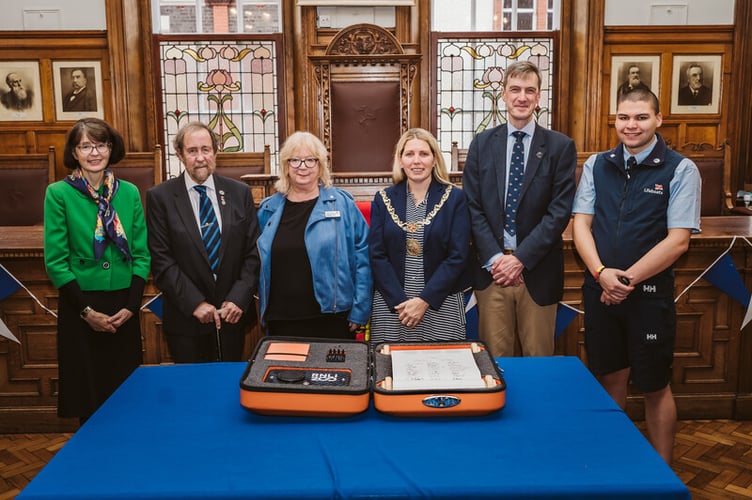 A group photo after RNLI Chief Executive Peter Sparkes signed the 'Connecting our Communities' scroll at Douglas City Hall