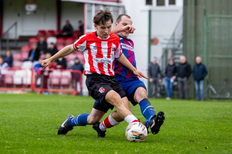 Ellis Dunn (left) shone in the centre of the pitch for Peel against Foxdale and Ste Bettridge during last weekend's Canada Life Premier League clash at Douglas Road (Photo: Gary Weightman)
