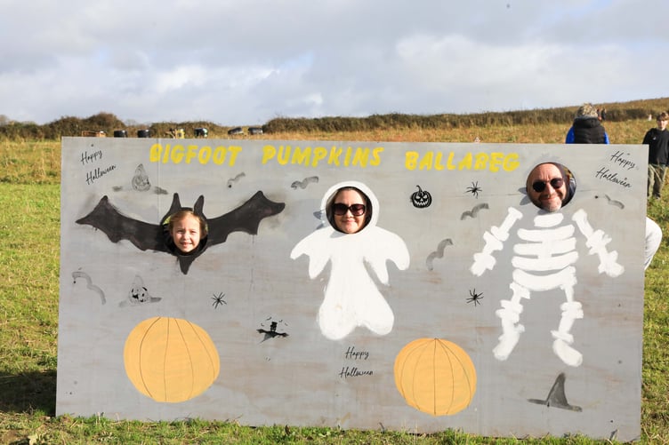 A bat, a ghost and a skeleton are spotted in the pumpkin fields